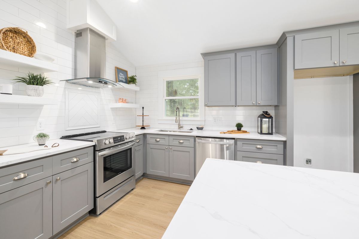 L-Shaped Kitchen design by AR Enterprises